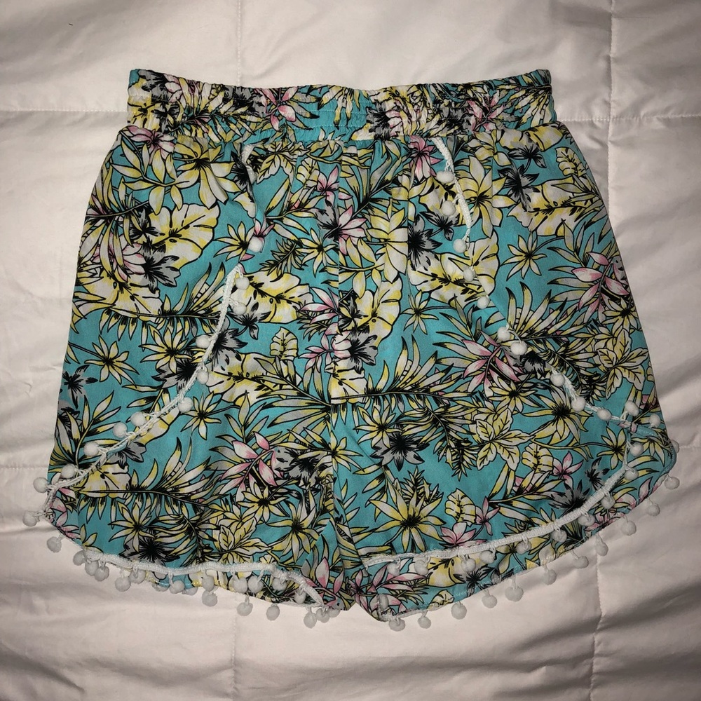 Floral silky shorts with Pom Pom hem detail